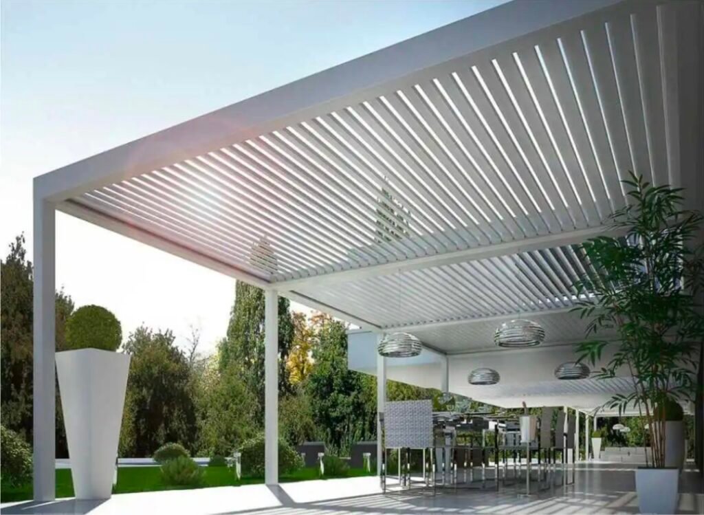 A modern white aluminum bioclimatic pergola over a patio area | housetopic
