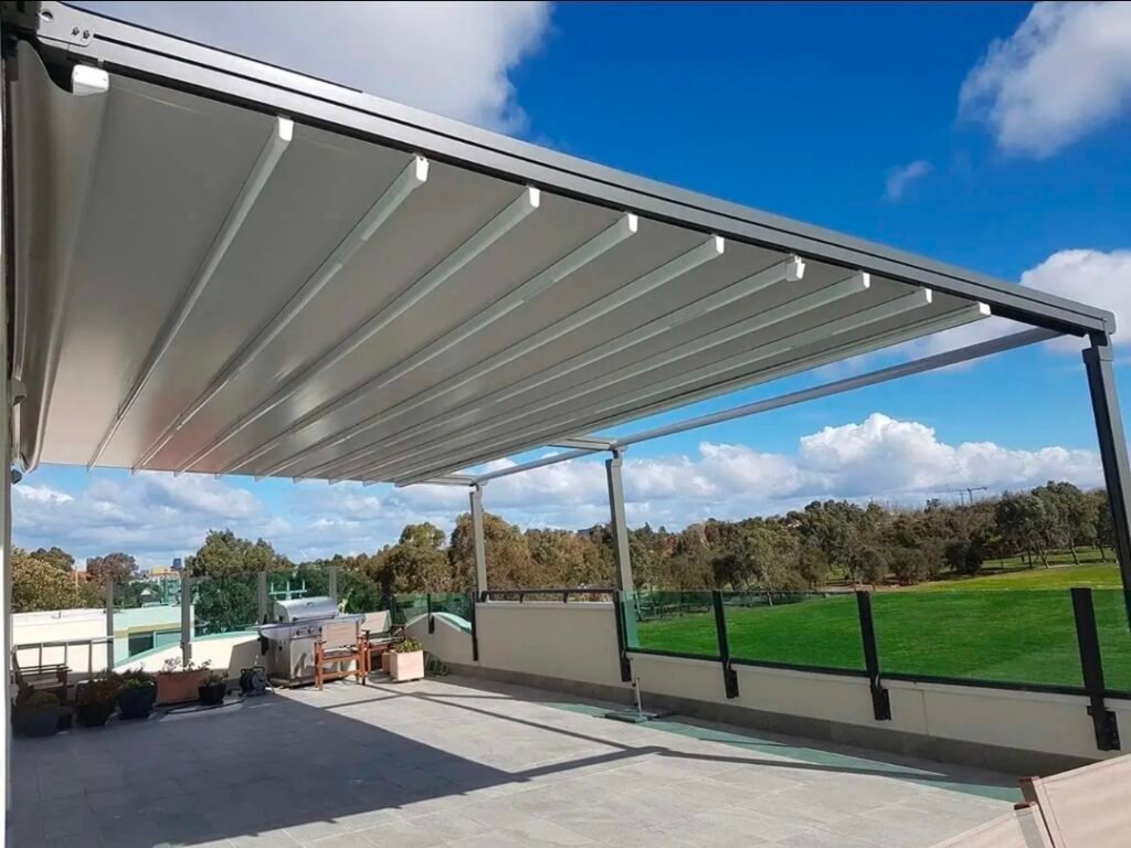 Motorised retractable pergola covering an outdoor garden entertaining area