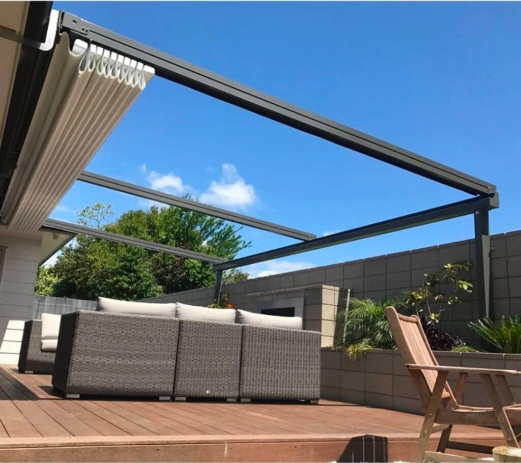 Motorised retractable pergola over a modern outdoor lounge area