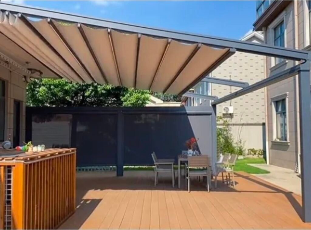 Motorised retractable pergola providing shade over a residential patio