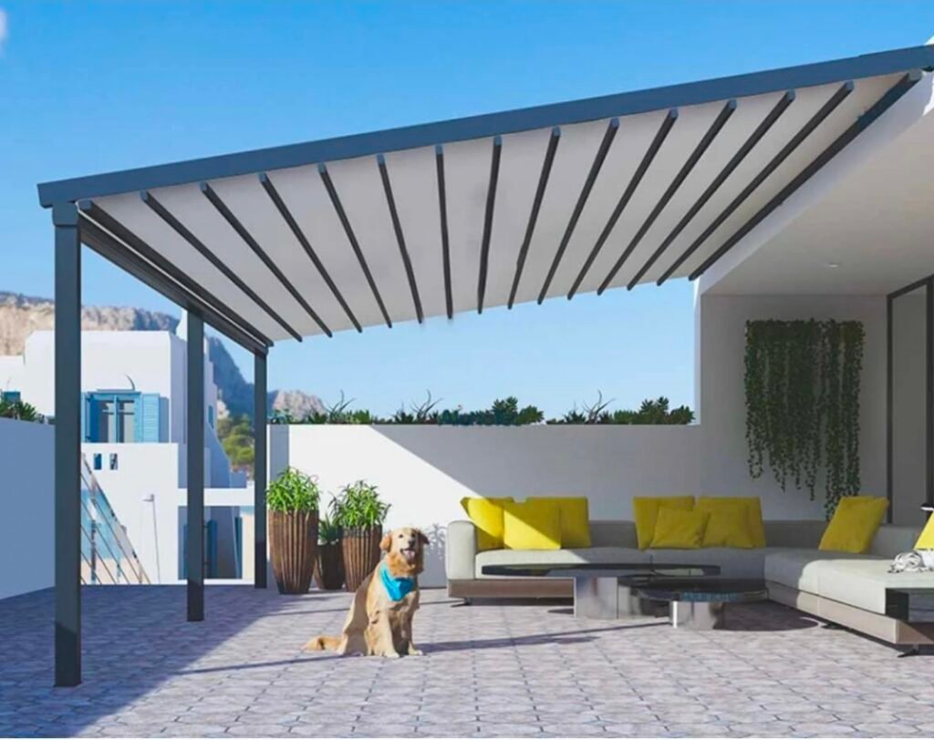 White motorised retractable pergola covering an outdoor living area